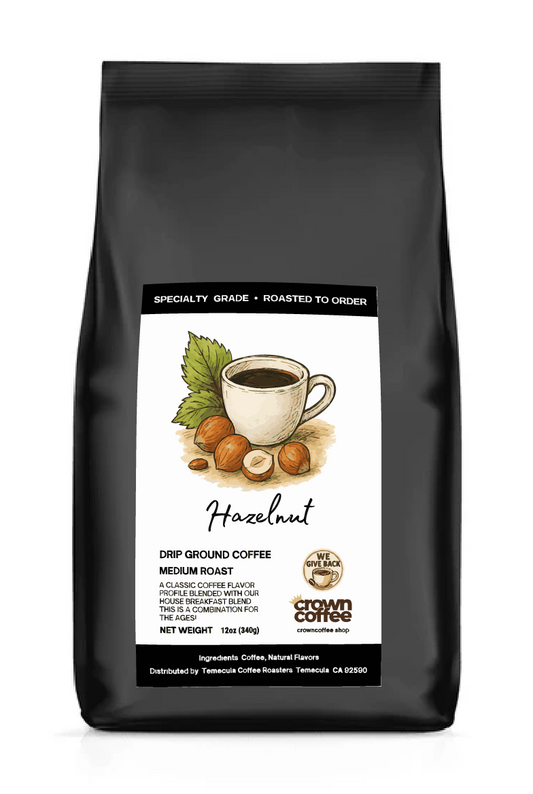 Black flat bottom bag. Drawing of coffee surrounded by hazelnuts